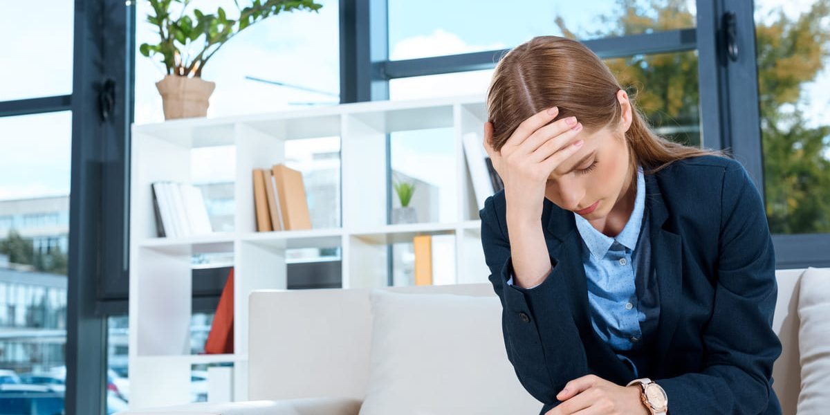 portrait-of-depressed-young-businesswoman-with-han-2024-11-18-07-25-24-utc(1)